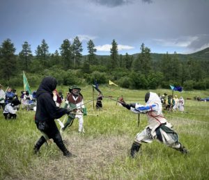 Two fencers, fighting